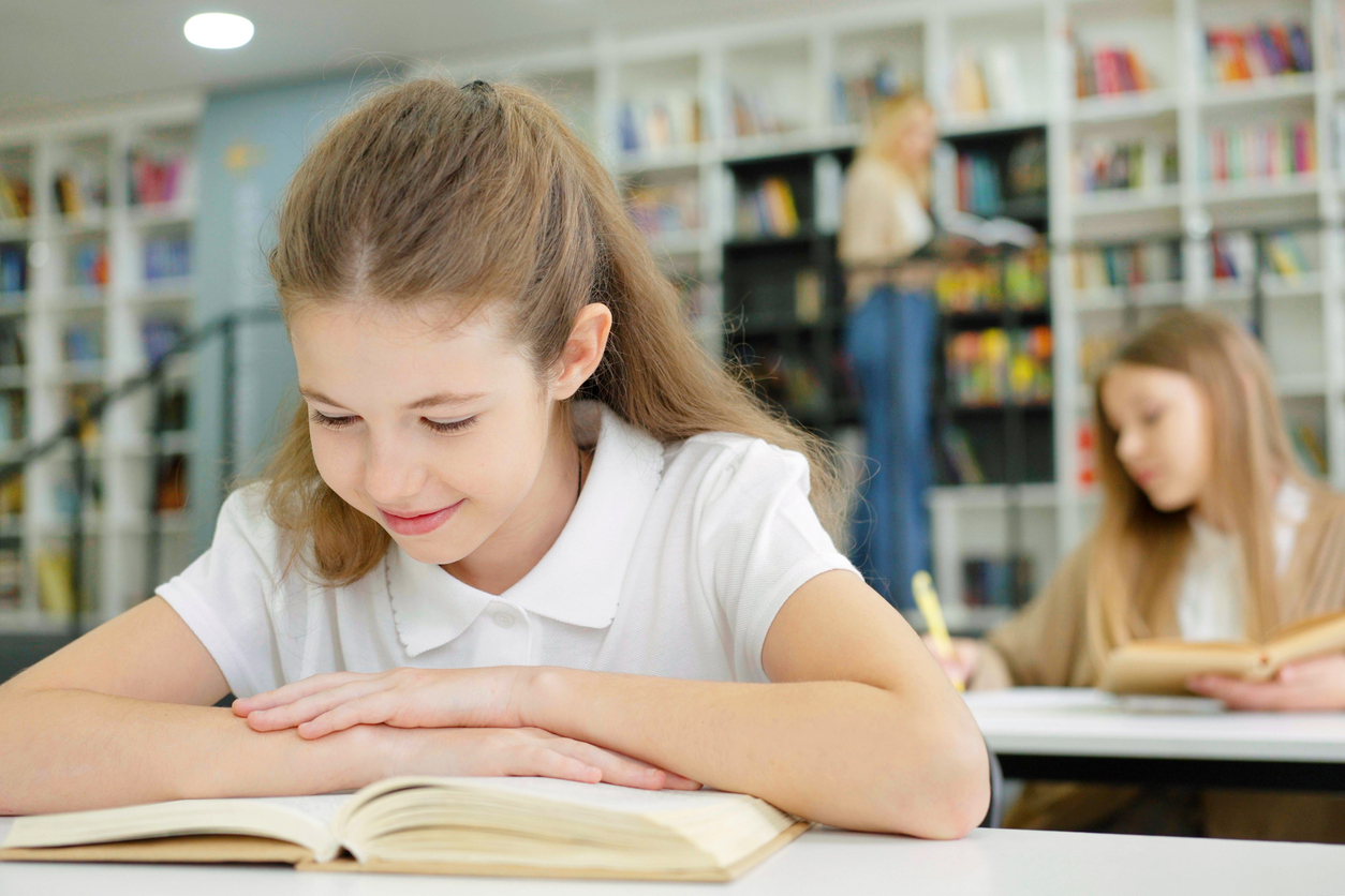 A girl enjoying reading a book