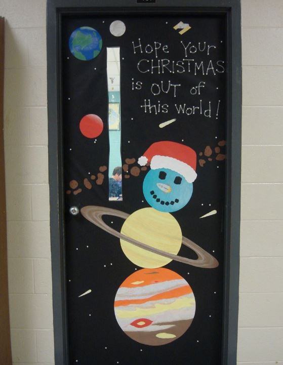 Snowman in space Christmas decoration for a classroom door